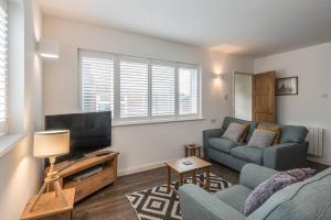 A seating area at Seascape - Modern one bedroom, two storey annexe