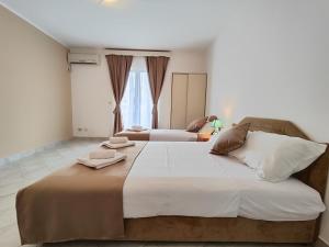 Postel nebo postele na pokoji v ubytování Villa Hera