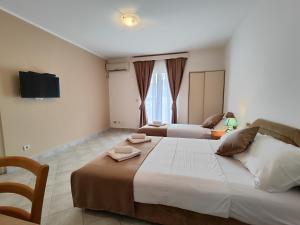 Postel nebo postele na pokoji v ubytování Villa Hera