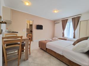 Postel nebo postele na pokoji v ubytování Villa Hera