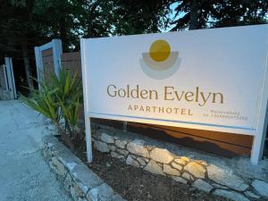 a sign for the golden eyen amph battlefield at Golden Evelyn in Agia Paraskevi