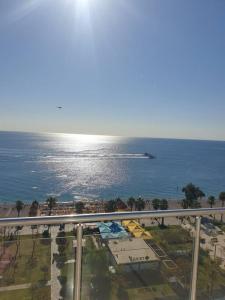 a view of the ocean from a balcony of a resort at Antalya Konyaaltı Plajında dublex GEMİ EV in Antalya