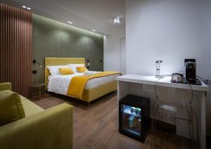 a bedroom with a bed and a fireplace in it at Sofi' Center Rooms in Sciacca