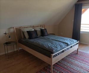 Postel nebo postele na pokoji v ubytování Hillside Nagymaros