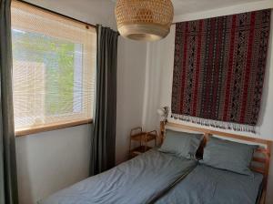 Postel nebo postele na pokoji v ubytování Hillside Nagymaros
