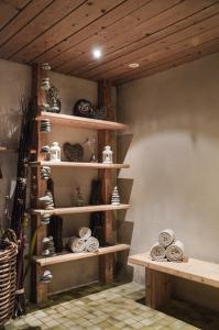 a room with wooden shelves with bowls and plates at Hotel Ehrwalderhof in Ehrwald