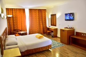 a hotel room with a bed and a sink at Verginia Sharm Resort & Aqua Park in Sharm El Sheikh