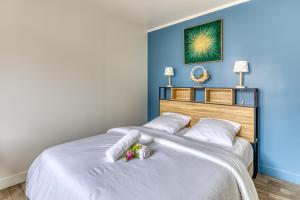 Ένα ή περισσότερα κρεβάτια σε δωμάτιο στο Relax en Normandie