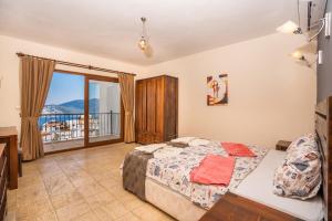 A bed or beds in a room at Talia Apart