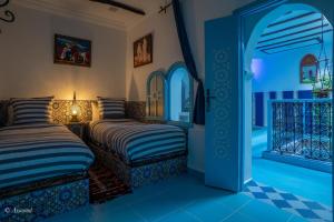 Tempat tidur dalam kamar di Dar Qaysar