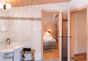 a bathroom with a sink and a toilet at Haus Luisa by Emju in Tschagguns +263 photos
