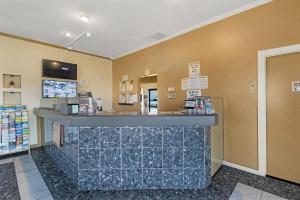 a lobby of a pharmacy with a counter in a store at Heritage Inn Express Roseville in Roseville