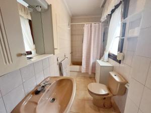 a bathroom with a sink and a toilet at A Estribor - 20001 in Argoños +28 photos