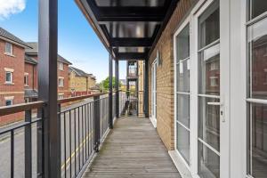 a balcony with a walkway between two buildings at Luxnightzz - Two Bed - Close to North Station and Hospital in Colchester