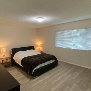 a bedroom with a large bed and a window at House in Thousand Oaks in Thousand Oaks