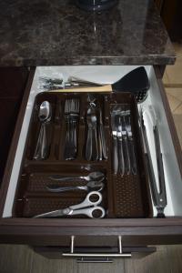 a tray filled with utensils on top of a counter at 105 on Sarel Cilliers in Strand