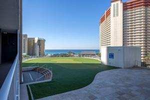 a golf course on the balcony of a building at Laketown Wharf #1819 by Nautical Properties in Panama City Beach