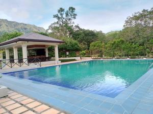 a swimming pool with a gazebo at Villa Marilyn Resort and Hotel in Coron