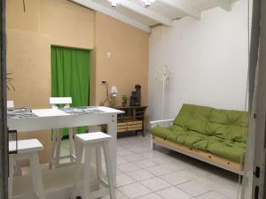 a living room with a green couch and a table at MarieT in Viedma