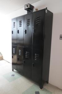a group of lockers in a room with a wall at Metamorfosis in Medellín