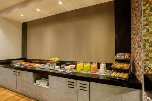a buffet line with food in a hotel room at Camino Real Pedregal Mexico in Mexico City
