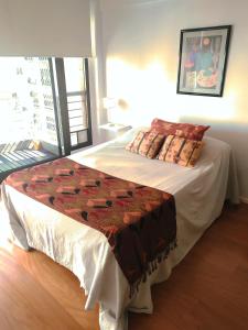 A bed or beds in a room at Comodidad, óptima ubicación y tranquilidad en Nuñez