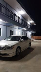 a white car parked in front of a building at ซีนายเฮ้าส์ Z9 House in Ban Kao