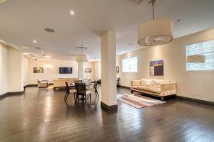 a living room with a couch and a table at Hollywood Condos in Hollywood