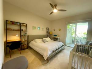 a bedroom with a bed and a ceiling fan at Next to Puntarena Beach Club! - Amazing Balcony - Sleeps 6 in Boca de Río Hato