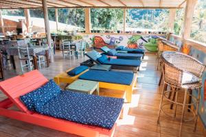a row of tables and chairs on a patio at Pousada Morango das Palmas in Praia de Palmas