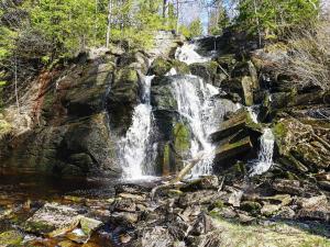 a waterfall on the side of a rocky river at Holiday home HÄLLEVADSHOLM II in Hällevadsholm