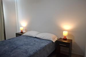 A bed or beds in a room at DEPARTAMENTOS DORREGO 2