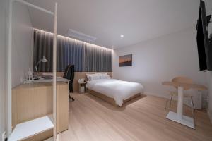 Letto o letti in una camera di Aank Hotel Daejeon Yuseong 1st