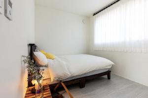 Postel nebo postele na pokoji v ubytování Panpo HyunStay