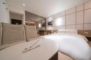 Letto o letti in una camera di Aank Hotel Daejeon Yuseong 1st