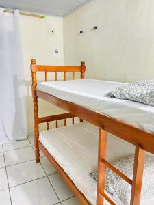 a pair of bunk beds in a room at Recanto do paraiso in Itacaré