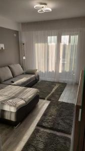 Un pat sau paturi într-o cameră la VEL Beach Apartment