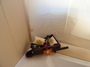 a shelf in the corner of a shower with a mirror at Hostal San Juan in Quito