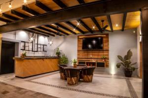 a kitchen and dining room with a table and chairs at Villa Guadalupe in Chapala