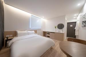 Aank Hotel Daejeon Yuseong 2nd房間的床