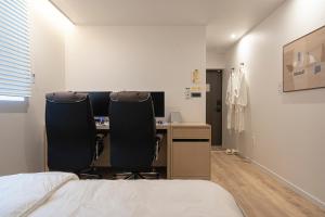 Aank Hotel Daejeon Yuseong 2nd房間的床