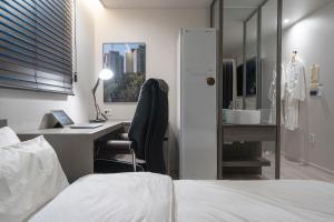 Aank Hotel Daejeon Yuseong 2nd房間的床