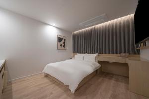 Aank Hotel Daejeon Yuseong 2nd房間的床