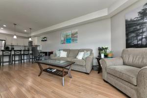 a living room with a couch and a table at Stay In The Okanagan - Copper Sky, West Kelowna in West Kelowna