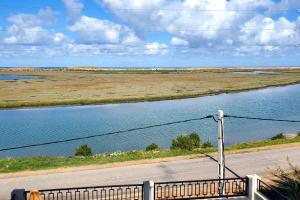 a road next to a river with a view at New apartment with water view in El Jadida
