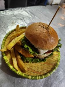 a basket with a sandwich and french fries on a table at NALDUM VILLAGE RESORT By The Edge Nagarkot in Nagarkot