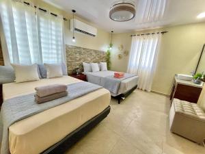 מיטה או מיטות בחדר ב-Villa Marot Eventos