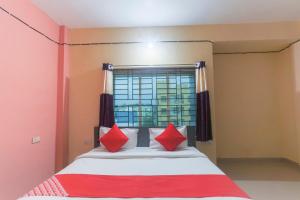 Postel nebo postele na pokoji v ubytování Hotel O Avigna Residency