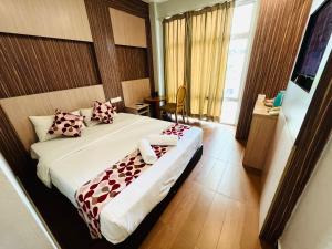 Postel nebo postele na pokoji v ubytování Sky Hotel @ Pudu