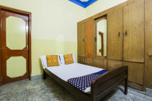 מיטה או מיטות בחדר ב-SPOT ON Cherish Guest House